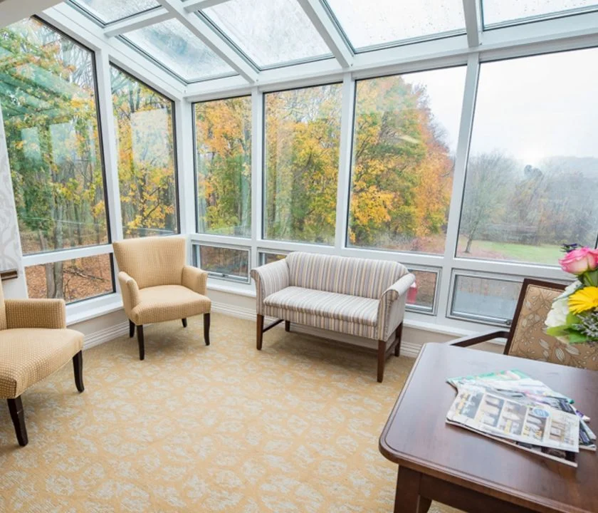 three women sitting on a Cedar Ridge front porch