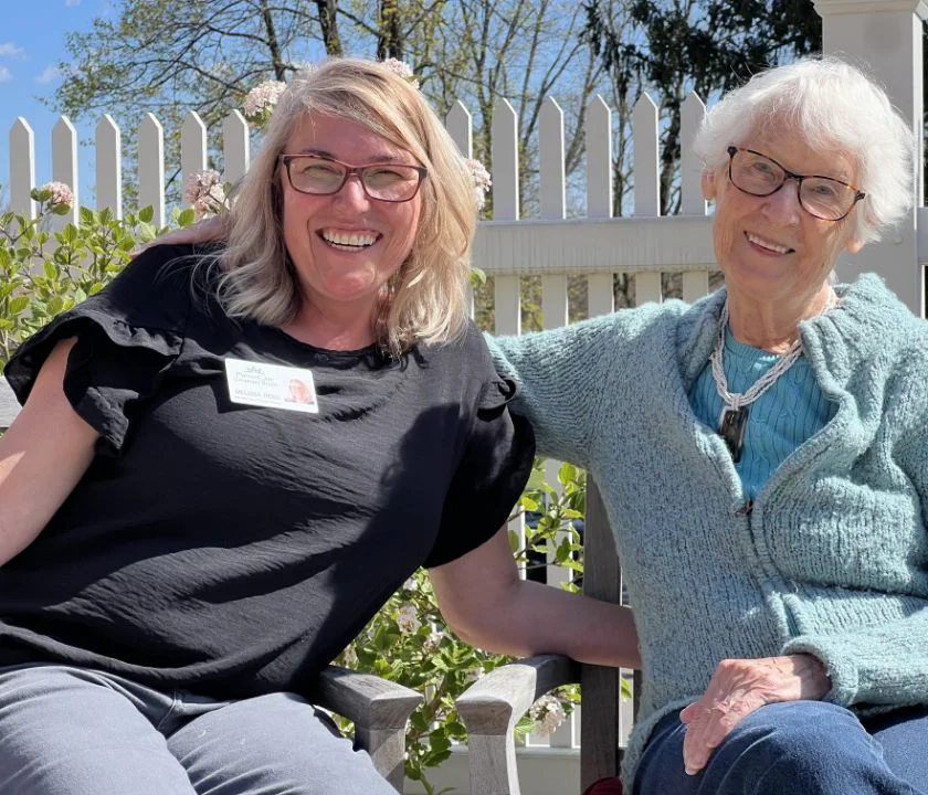 two women in hats on patio
